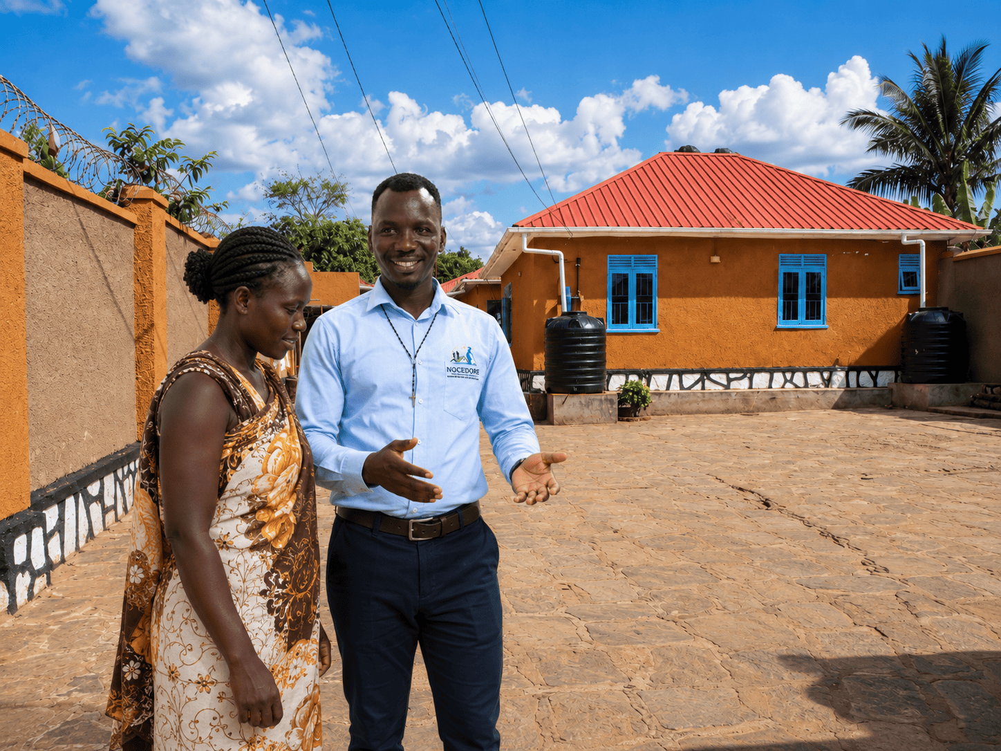 NOCEDORE advisor discussing property with a client in Gulu
